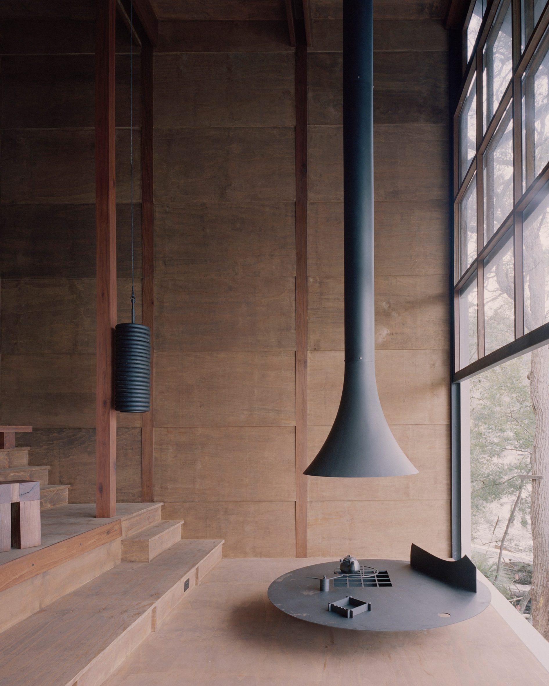 Suspended fireplace in a wooden living room
