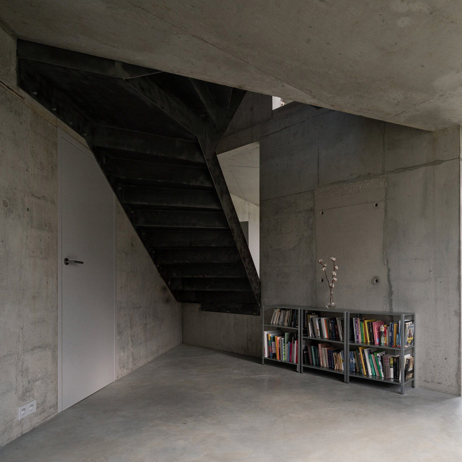 Metal staircase and concrete walls