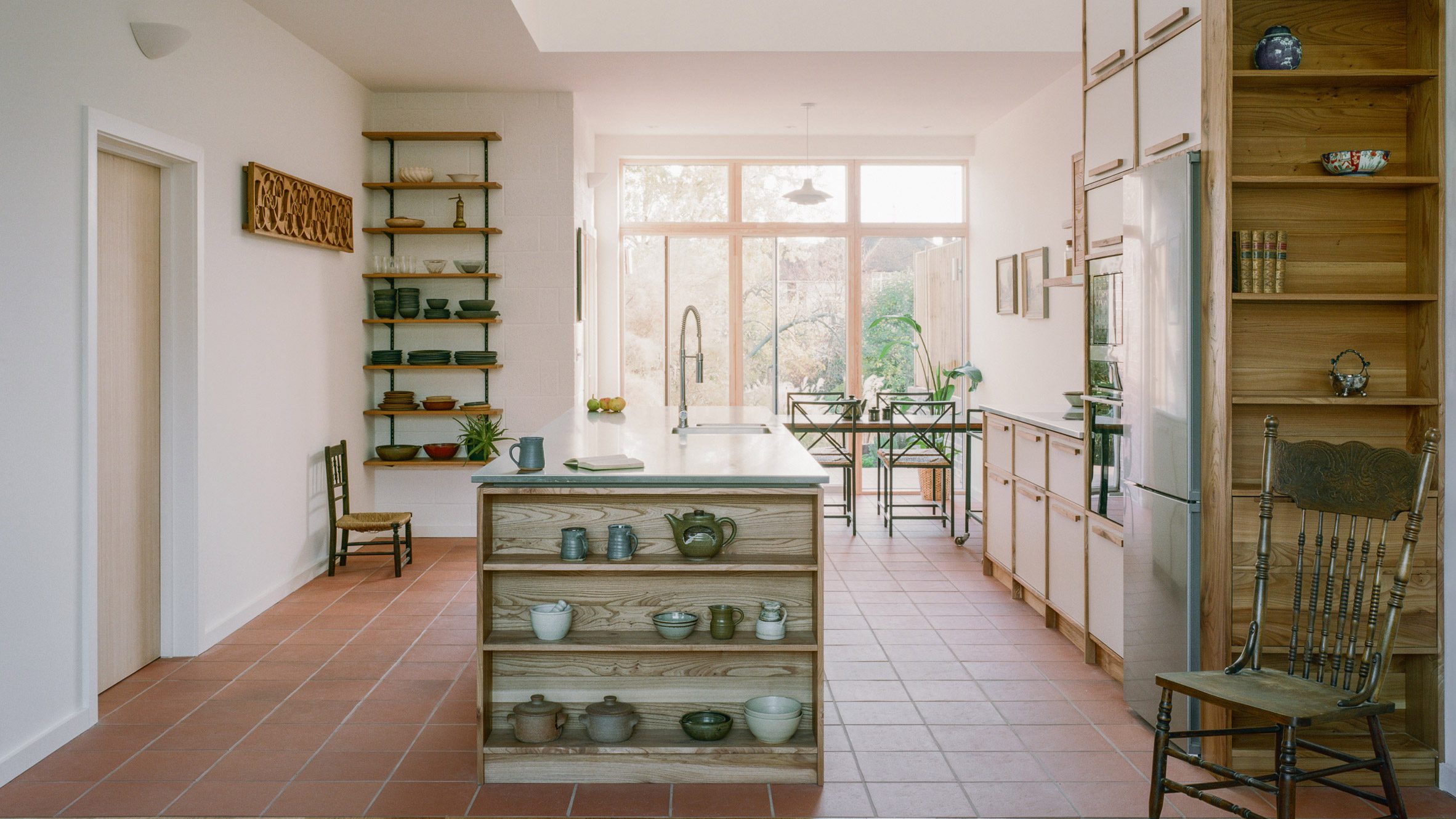 Woodbury Residence by Of Architecture with open shelf kitchen