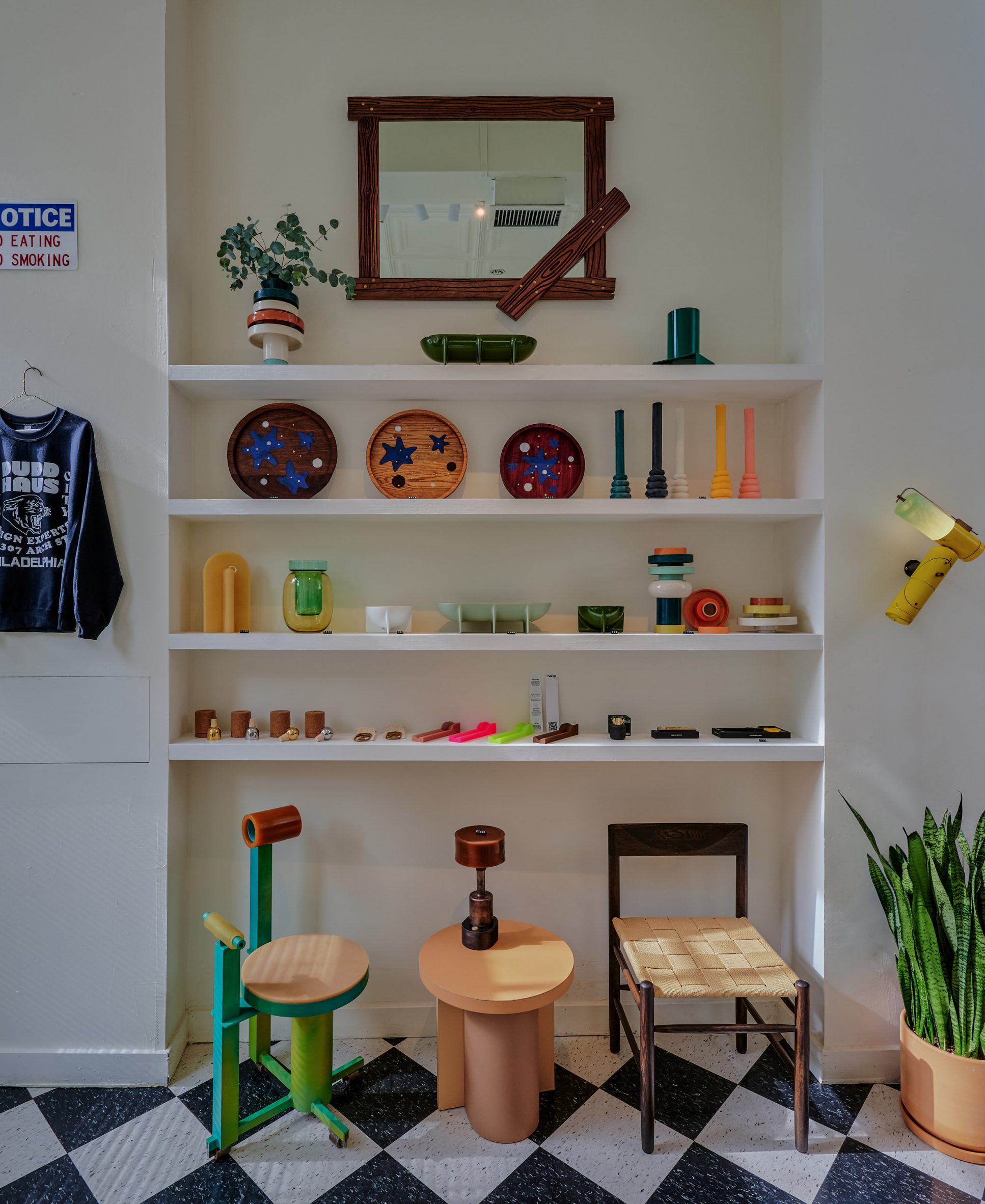 Display of seating and small objects on shelves