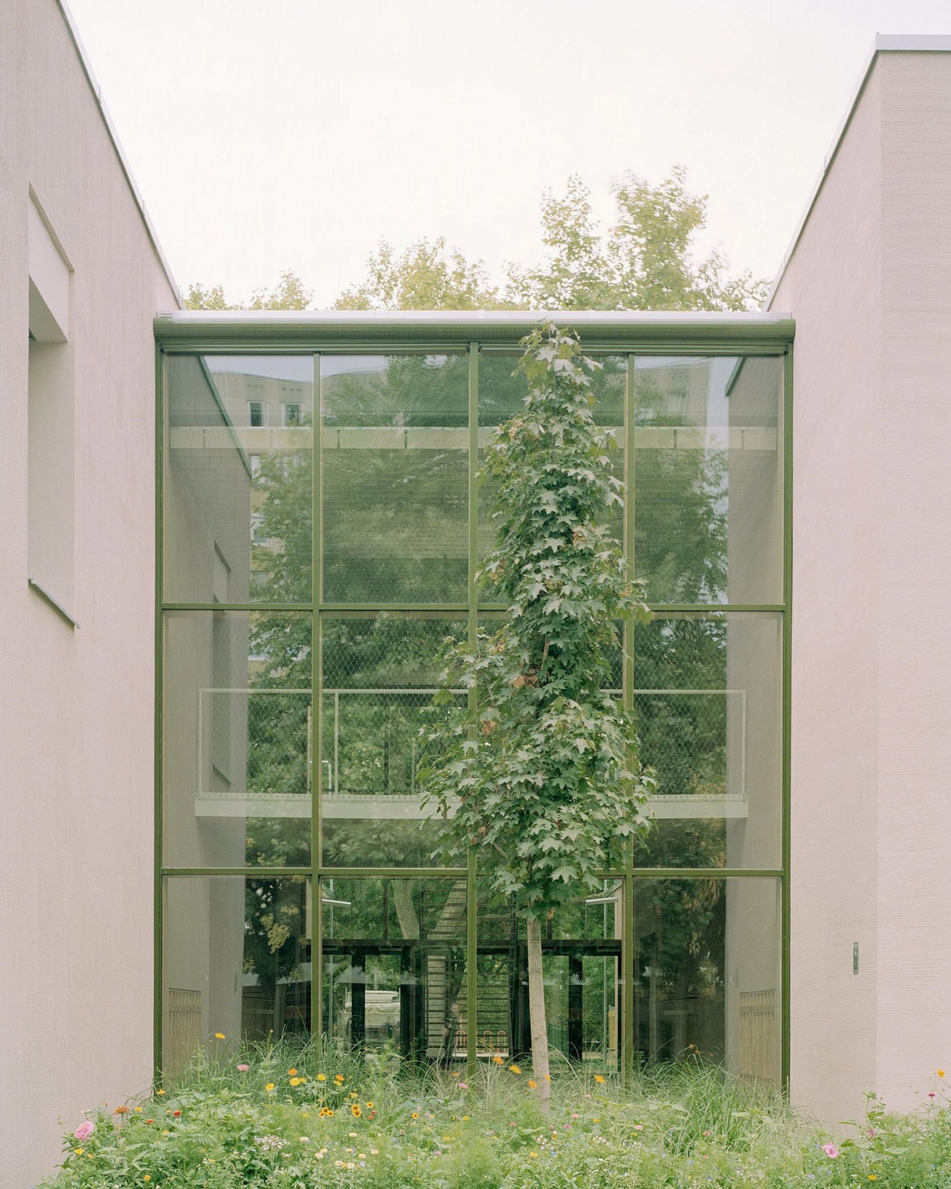 Full-height window of Gyöngyszem Kindergarten by Archikon
