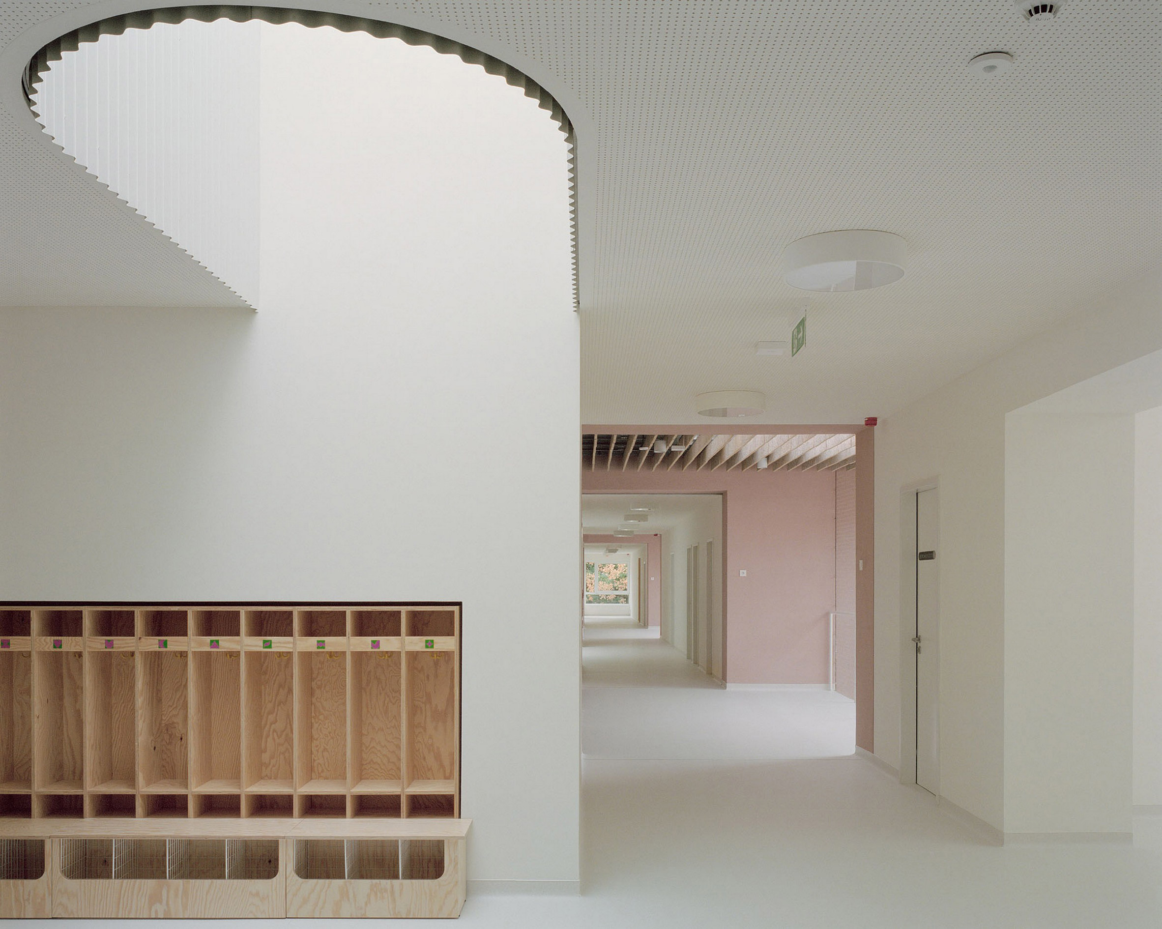 Corridor within nursery by Archikon