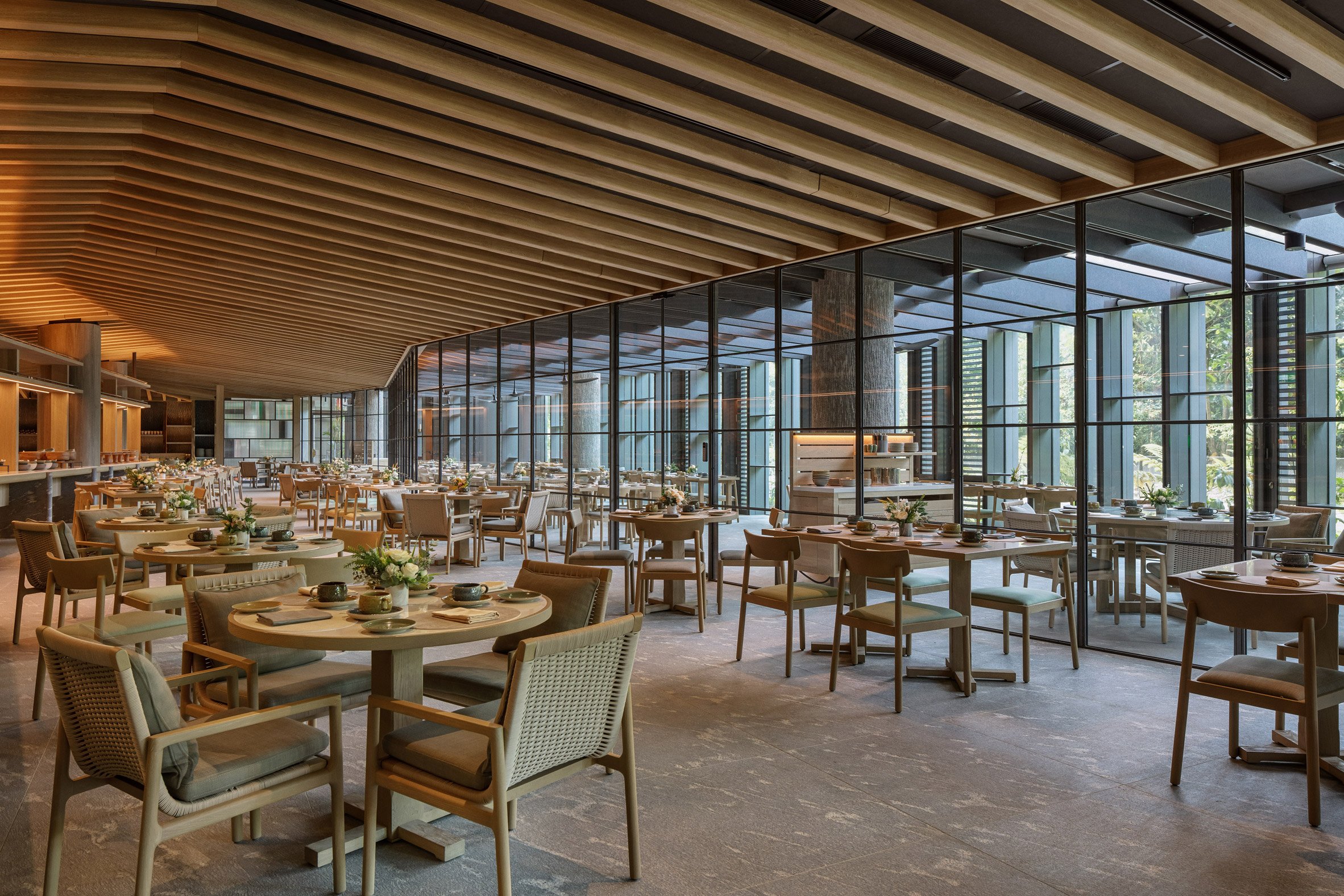 Dining space at Mandai Rainforest Resort by Banyan Tree by WOW Architects