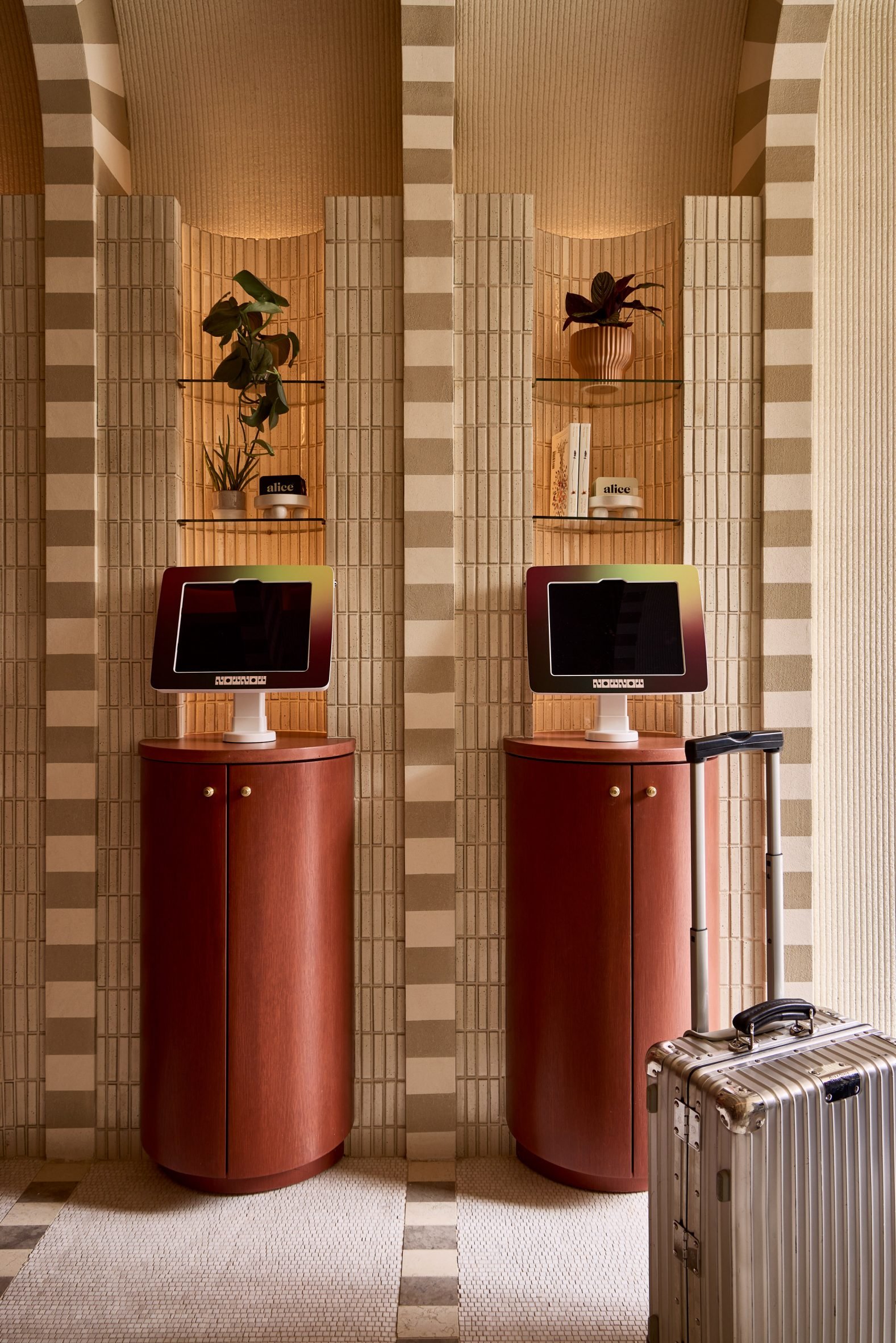Self-check in machines on wooden podiums